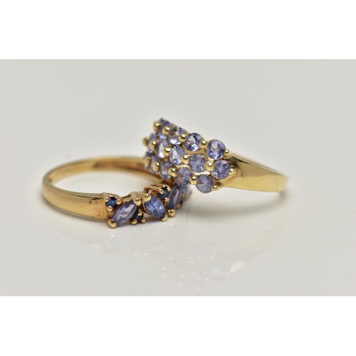 28 - TWO 9CT GOLD TANZANITE RINGS, the first designed with a row of three circular cut tanzanite, sixteen... 