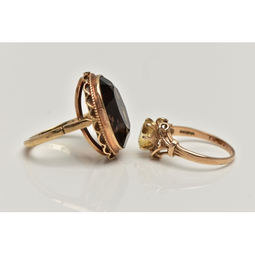 29 - TWO GEMSTONE SET RINGS, the first a large oval smoky quartz, measuring approximately length 18.7mm x... 