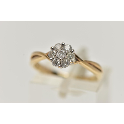 30 - A 9CT GOLD DIAMOND CLUSTER RING, of a flower shape, set with seven round brilliant cut diamonds, eac... 