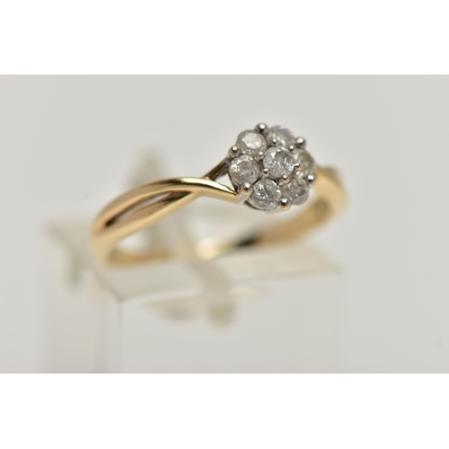 30 - A 9CT GOLD DIAMOND CLUSTER RING, of a flower shape, set with seven round brilliant cut diamonds, eac... 