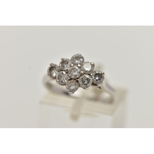 35 - AN 18CT WHITE GOLD DIAMOND CLUSTER RING, of a marquise outline, set with nine round brilliant cut di... 