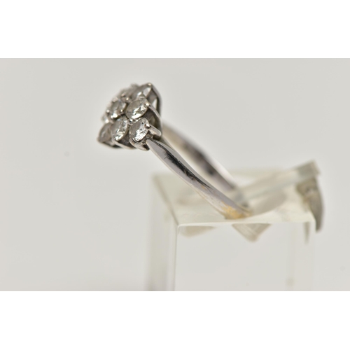 35 - AN 18CT WHITE GOLD DIAMOND CLUSTER RING, of a marquise outline, set with nine round brilliant cut di... 