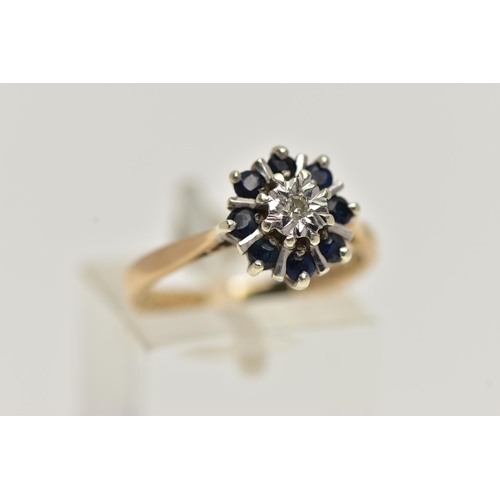 41 - A 9CT GOLD SAPPHIRE AND DIAMOND CLUSTER RING, centring on a single cut diamond illusion set, in a su... 