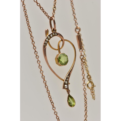 46 - A YELLOW METAL GEM SET LAVALIER PENDANT NECKLACE,  the openwork heart shaped pendant, set with a hex... 