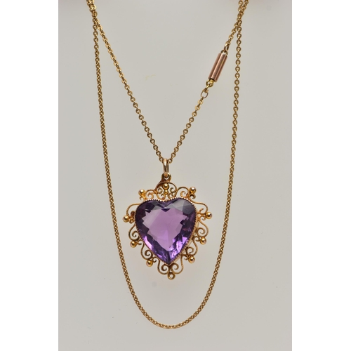 47 - A YELLOW METAL AMETHYST PENDANT NECKLACE, heart cut amethyst, milgrain collet set within a cannetill... 