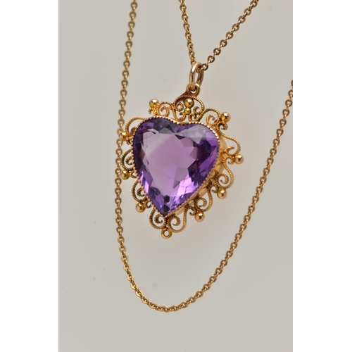 47 - A YELLOW METAL AMETHYST PENDANT NECKLACE, heart cut amethyst, milgrain collet set within a cannetill... 