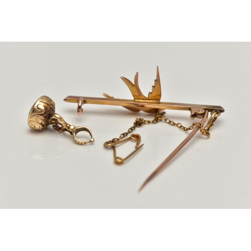 49 - A YELLOW METAL SWALLOW BROOCH AND A SMALL FOB SEAL PENDANT, swallow bird set with split pearls, to a... 