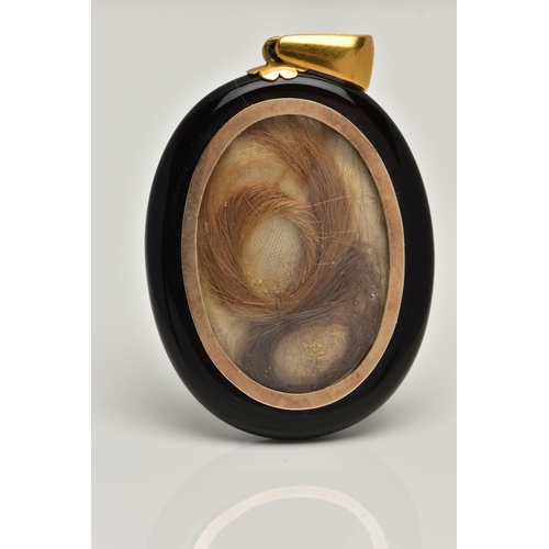 54 - A VICTORIAN ONYX AND SPLIT PEARL MOURNING LOCKET PENDANT, onyx oval form displaying a yellow metal c... 