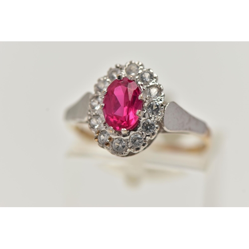 58 - A 9CT GOLD CLUSTER RING, of an oval form, centring on an oval cut synthetic ruby, in a surround of c... 