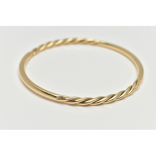 7 - A 9CT YELLOW GOLD BANGLE, twist and polished bangle, hallmarked 9ct Birmingham, approximate internal... 