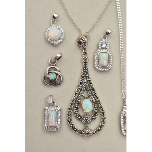 83 - TWO PENDANT NECKLACES AND FOUR PENDANTS, the first pendant of an openwork tear drop shape, set with ... 