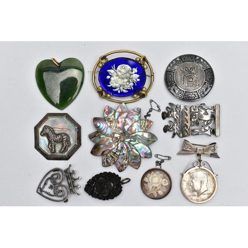 98 - AN ASSORTMENT OF PENDANTS AND BROOCHES, the first a heart shaped nephrite jade pendant, fitted with ... 