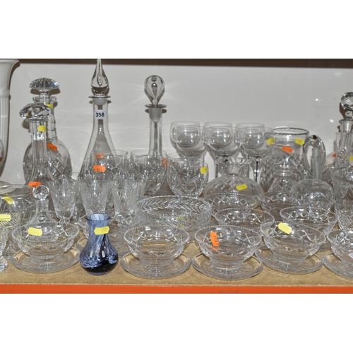 358 - A GROUP OF CUT CRYSTAL, comprising a ship's decanter, a contemporary style decanter (chipped stopper... 