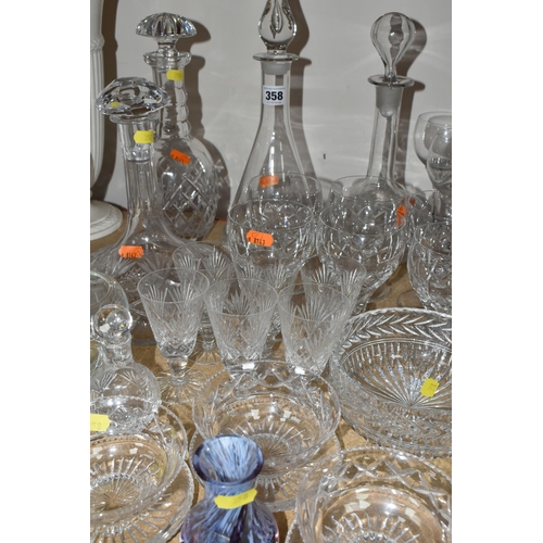 358 - A GROUP OF CUT CRYSTAL, comprising a ship's decanter, a contemporary style decanter (chipped stopper... 