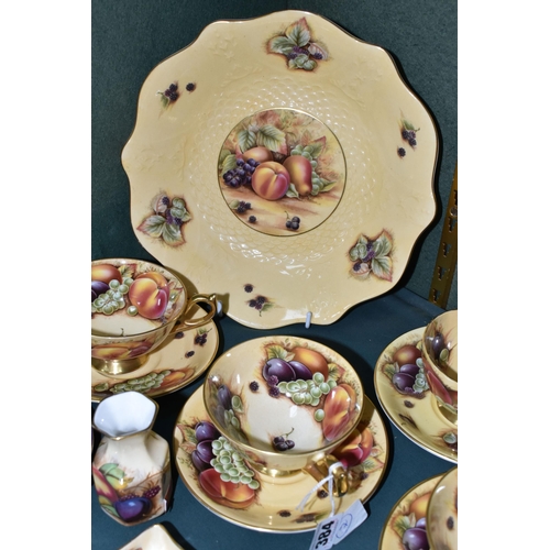 384 - SIXTEEN PIECES OF AYNSLEY ORCHARD GOLD TEA AND GIFT WARES, comprising a wavy edged fruit bowl, diame... 