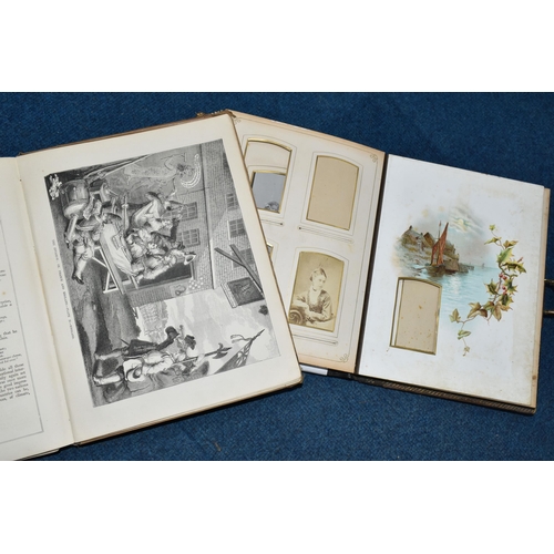 427 - A VICTORIAN PHOTOGRAPH ALBUM / MUSICAL BOX  in working order with key, leather -bound, brass clasped... 