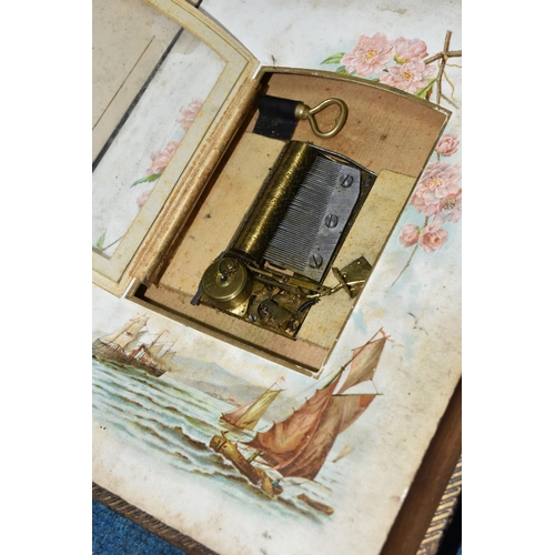 427 - A VICTORIAN PHOTOGRAPH ALBUM / MUSICAL BOX  in working order with key, leather -bound, brass clasped... 