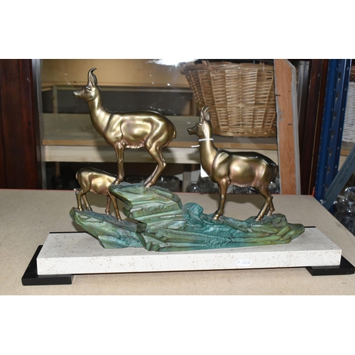 435 - A LARGE FRENCH ART DECO FIGURAL GROUP, of three deer on a hillside, cold painted metal on a black an... 