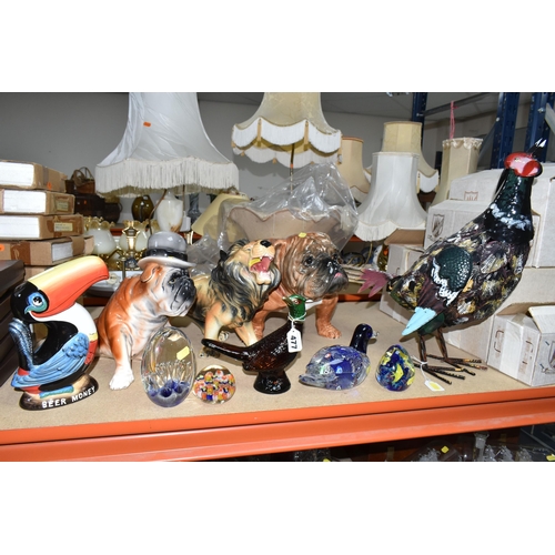 477 - A GROUP OF CERAMICS AND GLASS PAPERWEIGHTS, comprising a Guiness G0052 Heritage Toucan money box, a ... 