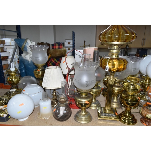 492 - A QUANTITY OF LAMPS AND SHADES, oil lamps and electric table lamps, to include a tall Duplex oil lam... 