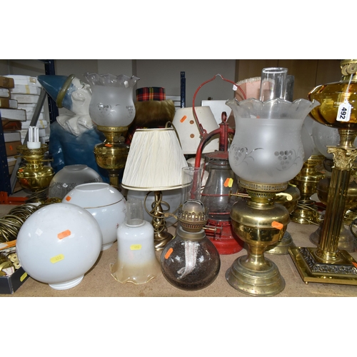 492 - A QUANTITY OF LAMPS AND SHADES, oil lamps and electric table lamps, to include a tall Duplex oil lam... 