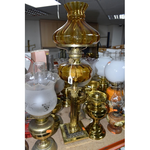 492 - A QUANTITY OF LAMPS AND SHADES, oil lamps and electric table lamps, to include a tall Duplex oil lam... 