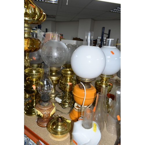 492 - A QUANTITY OF LAMPS AND SHADES, oil lamps and electric table lamps, to include a tall Duplex oil lam... 