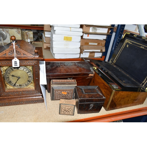 493 - A MANTEL CLOCK AND VARIOUS WOODEN BOXES, comprising a wooden cased mantel clock, carved with floral ... 