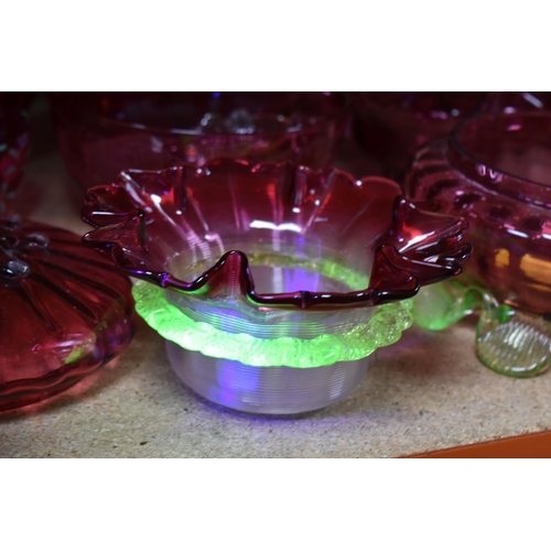 494 - A GROUP OF CRANBERRY GLASS, AND OTHER GLASS WARES, to include a cranberry and clear ribbed glass bow... 