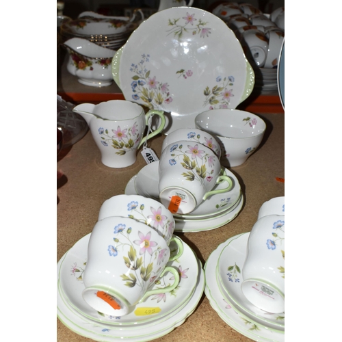 495 - A TWENTY ONE PIECE SHELLEY 'WILD ANEMONE' TEA SET, pattern 13977, comprising a cake plate, a cream j... 