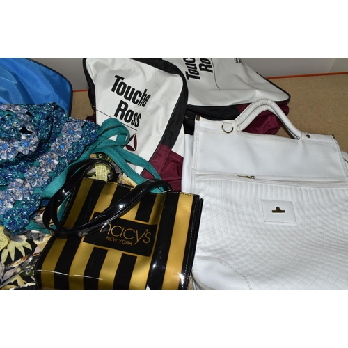 399 - A GROUP OF SEVEN VINTAGE HOLDALLS, comprising a nylon Touche Ross, blue and white Adidas, black and ... 