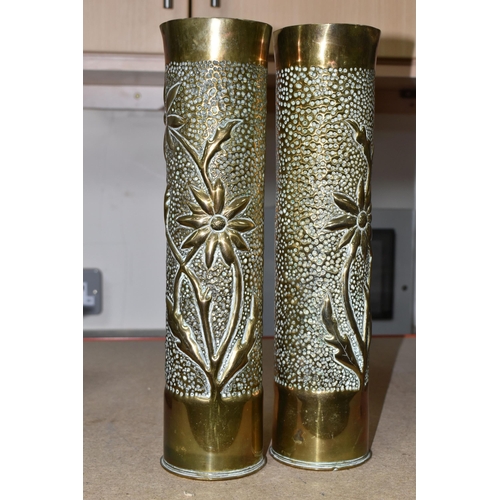 409 - A PAIR OF TRENCH ART SHELL CASES, both decorated with the matching stylised floral design (2)