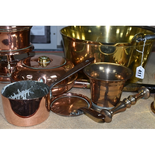 411 - A COLLECTION OF COPPERWARE AND BRASS, comprising a copper spirit kettle with a wicker handle, large ... 