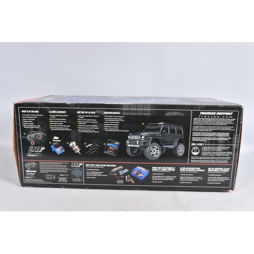 2 - A TRAXXAS REMOTE CONTROLLED FORD PICKUP TRUCK, heavy built frame, blue painted body with black and s... 