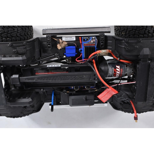 2 - A TRAXXAS REMOTE CONTROLLED FORD PICKUP TRUCK, heavy built frame, blue painted body with black and s... 