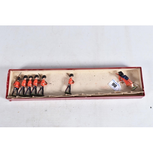 86 - A BOXED BRITAINS SCOTS GUARDS SET, No.75, playworn condition with paint loss and wear, missing offic... 