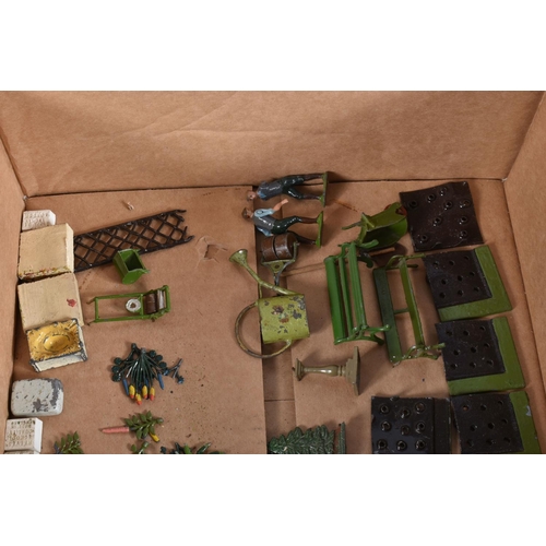 89 - A QUANTITY OF BRITAINS MINIATURE GARDEN ITEMS, to include Lawnmower, Roller, Wheelbarrow, Pond, Step... 