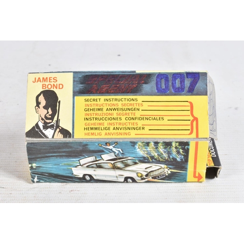 99 - A BOXED CORGI TOYS JAMES BOND ASTON MARTIN D.B.5. No.261, working features and suspension, complete ... 