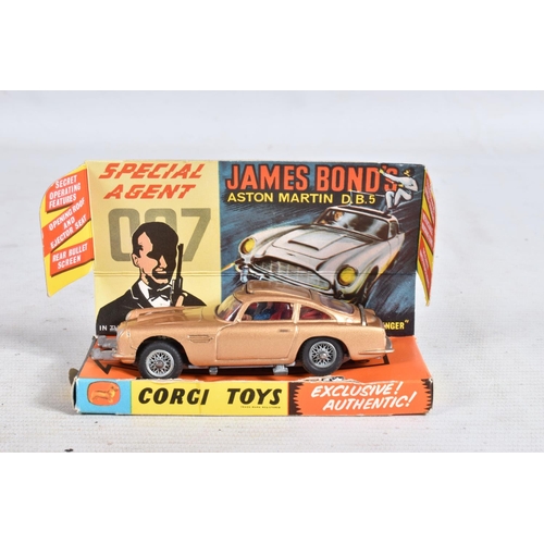 99 - A BOXED CORGI TOYS JAMES BOND ASTON MARTIN D.B.5. No.261, working features and suspension, complete ... 