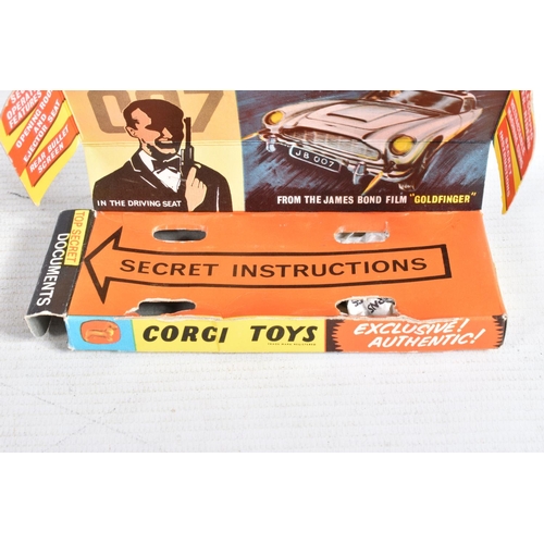 99 - A BOXED CORGI TOYS JAMES BOND ASTON MARTIN D.B.5. No.261, working features and suspension, complete ... 