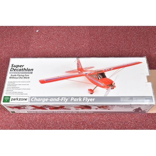 164 - A BOXED PARK ZONE SUPER DECATHLON CHARGE AND FLY PARK FLYER, red red primary colour with blue stripe... 