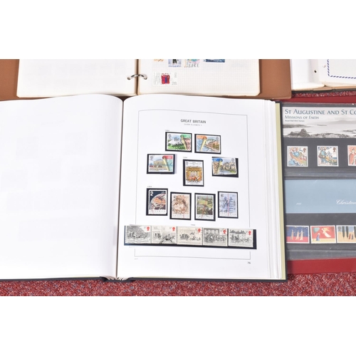 205 - COLLECTION OF STAMPS IN FOUR ALBUMS, we note GB presentation packs and a GB QE2 mint and used collec... 