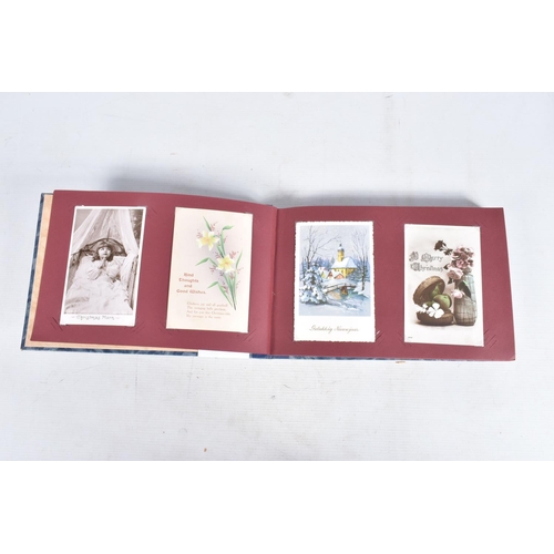 240 - POSTCARDS, two albums containing approximately 417* early 20th century CHRISTMAS Postcards (Edwardia... 