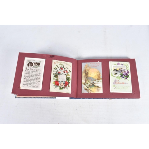 240 - POSTCARDS, two albums containing approximately 417* early 20th century CHRISTMAS Postcards (Edwardia... 