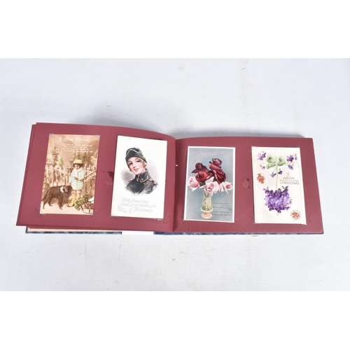 240 - POSTCARDS, two albums containing approximately 417* early 20th century CHRISTMAS Postcards (Edwardia... 