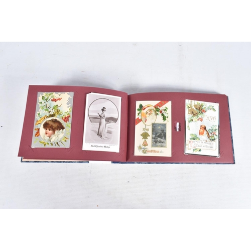 240 - POSTCARDS, two albums containing approximately 417* early 20th century CHRISTMAS Postcards (Edwardia... 