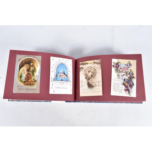 240 - POSTCARDS, two albums containing approximately 417* early 20th century CHRISTMAS Postcards (Edwardia... 