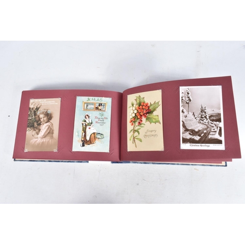 240 - POSTCARDS, two albums containing approximately 417* early 20th century CHRISTMAS Postcards (Edwardia... 