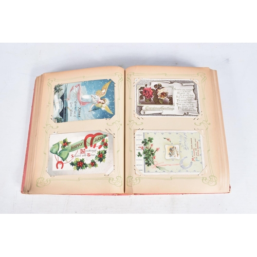 240 - POSTCARDS, two albums containing approximately 417* early 20th century CHRISTMAS Postcards (Edwardia... 