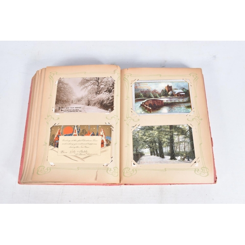 240 - POSTCARDS, two albums containing approximately 417* early 20th century CHRISTMAS Postcards (Edwardia... 